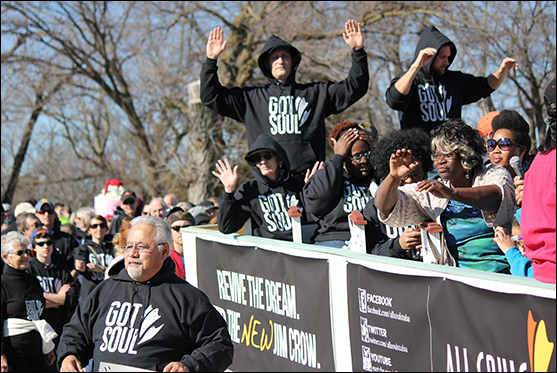 members of All Souls Unitarian Church in Tulsa, Oklahoma, marched in the Martin Luther King, Jr. Day Parade in Tulsa wearing hoodies.
