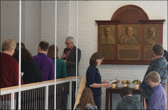 The Rev. Harlan Limpert leads UUA staff in reading a litany of rededication for a memorial to Jimmie Lee Jackson, the Rev. James Reeb, and Viola Liuzzo