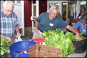 First Universalist Church members sort organic produce